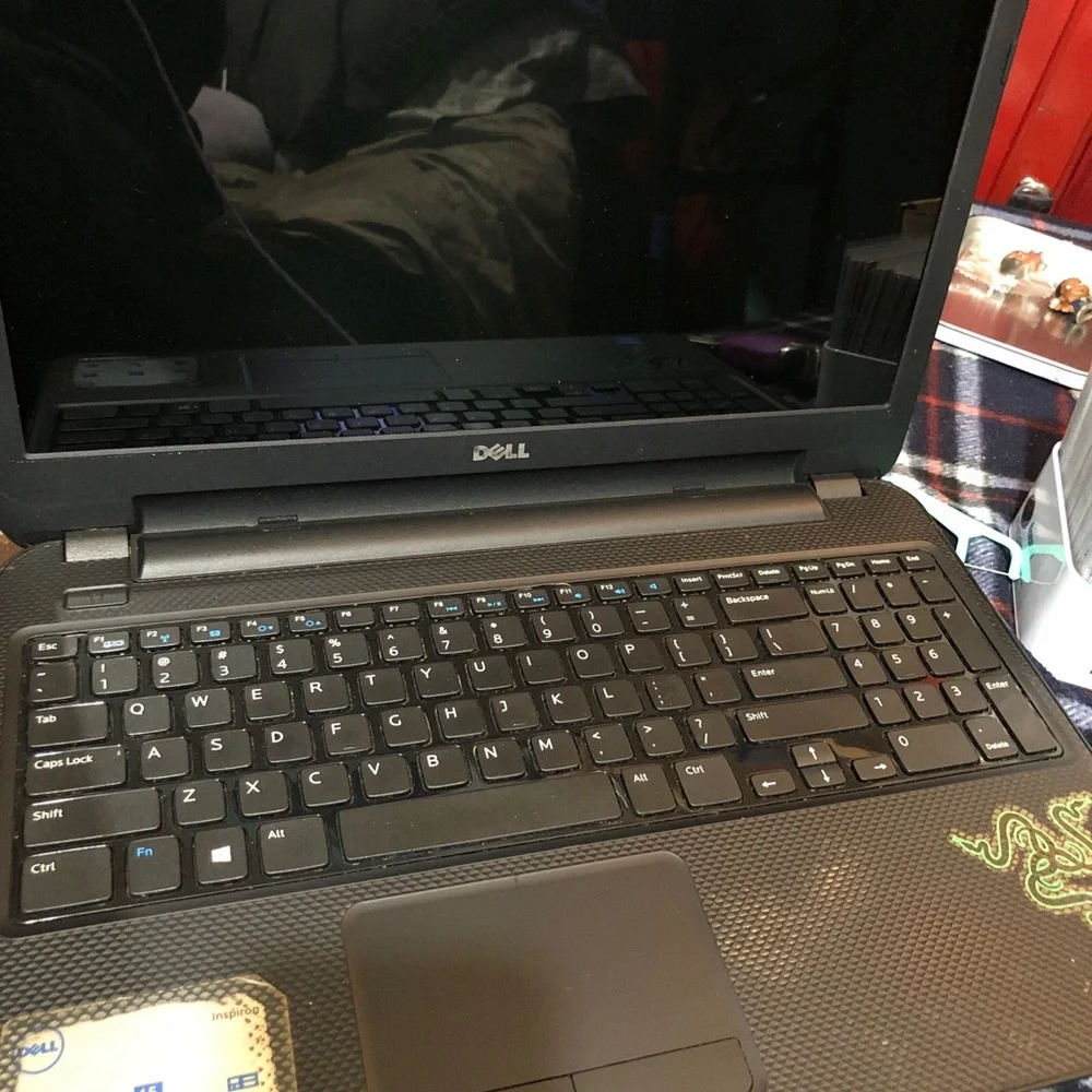 Apple MacBook with 4 chargers and dell laptop for parts